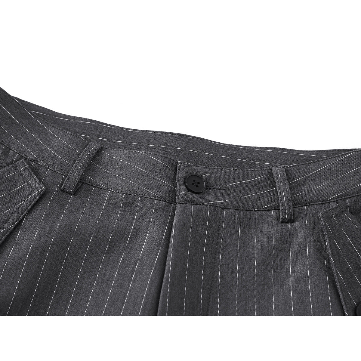 Close-up of charcoal pinstripe trousers showing the waistband, belt loops, pleats, and button closure.