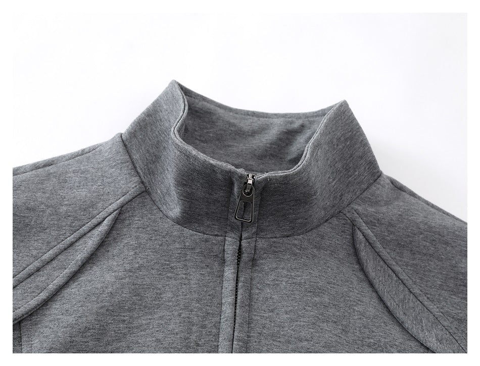 Close-up of a heather gray jacket's stand collar, front zipper, and shoulder seams.