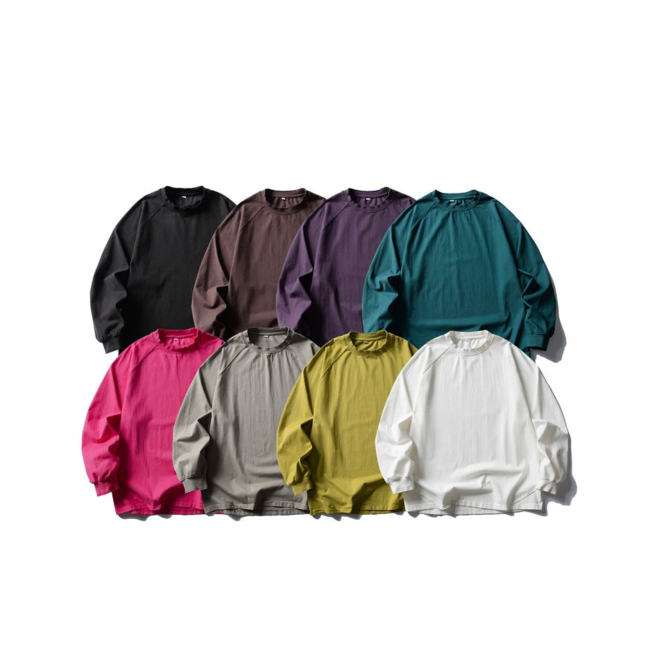 Eight long-sleeve shirts arranged in two rows in black, brown, purple, teal, pink, gray, olive, and white.