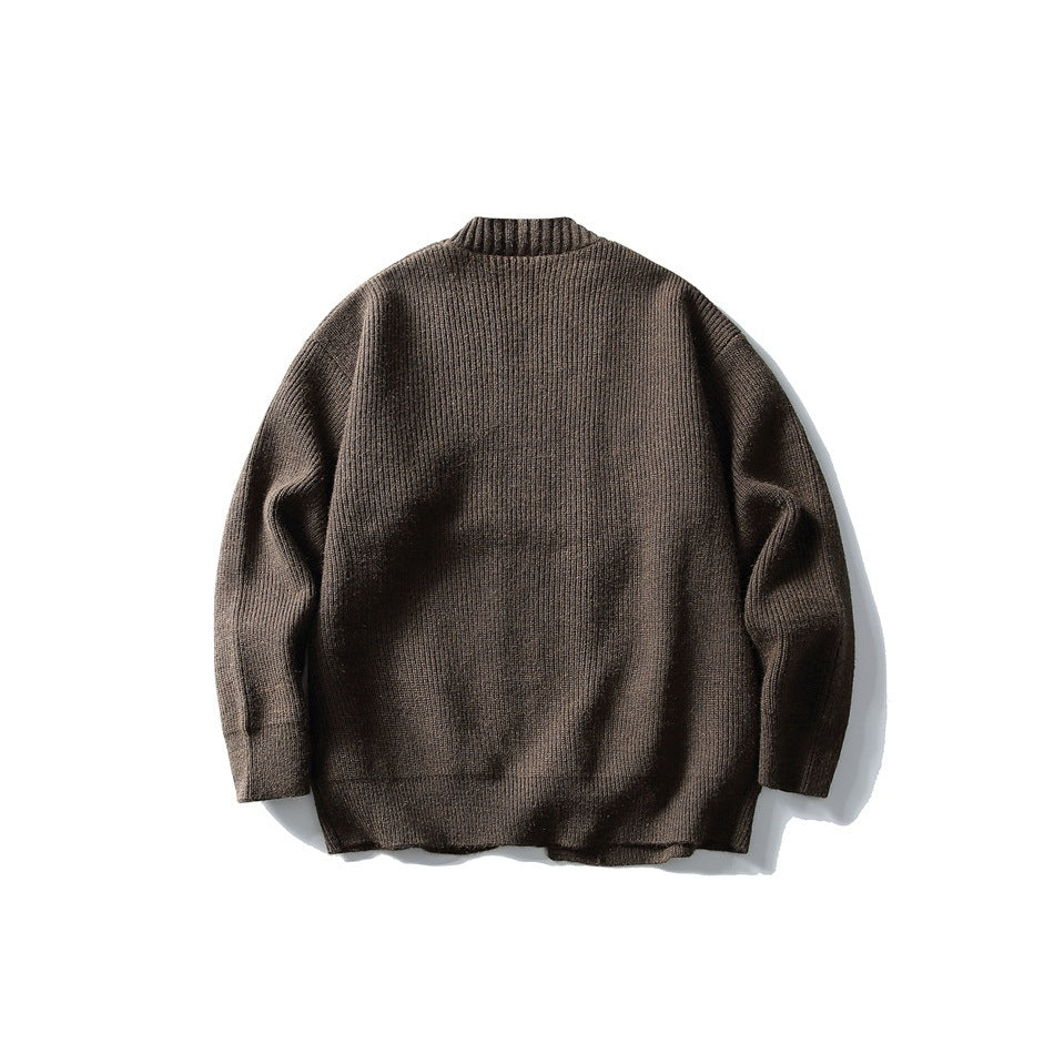 Back view of a brown rib-knit cardigan laid flat against a white background.