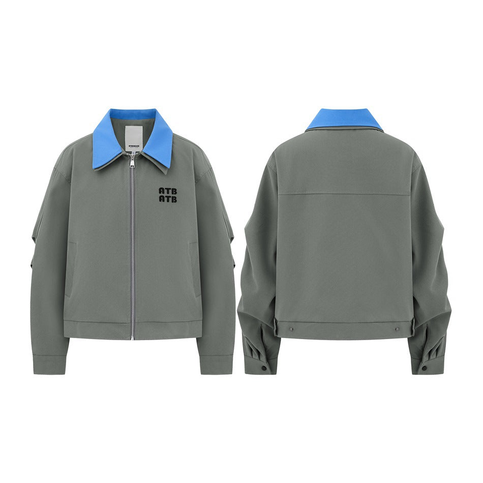 Gray-green zip-front jacket shown from the front and back, with a bright blue pointed collar and black chest embroidery.