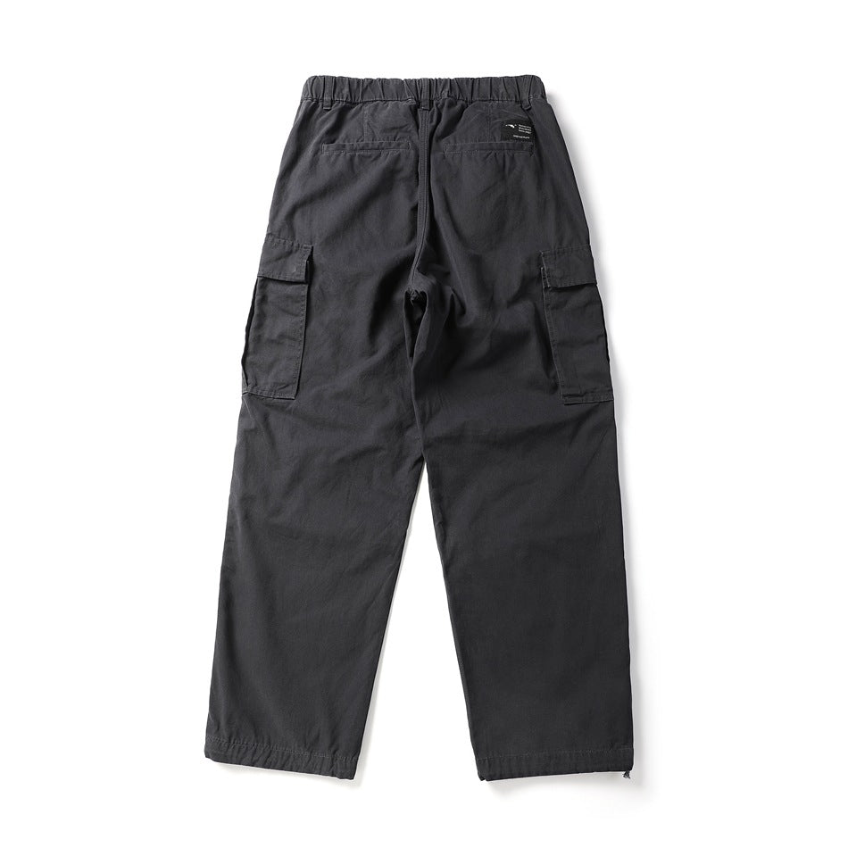 Back view of charcoal cargo pants with an elastic waist, two rear pockets, and side cargo pockets.