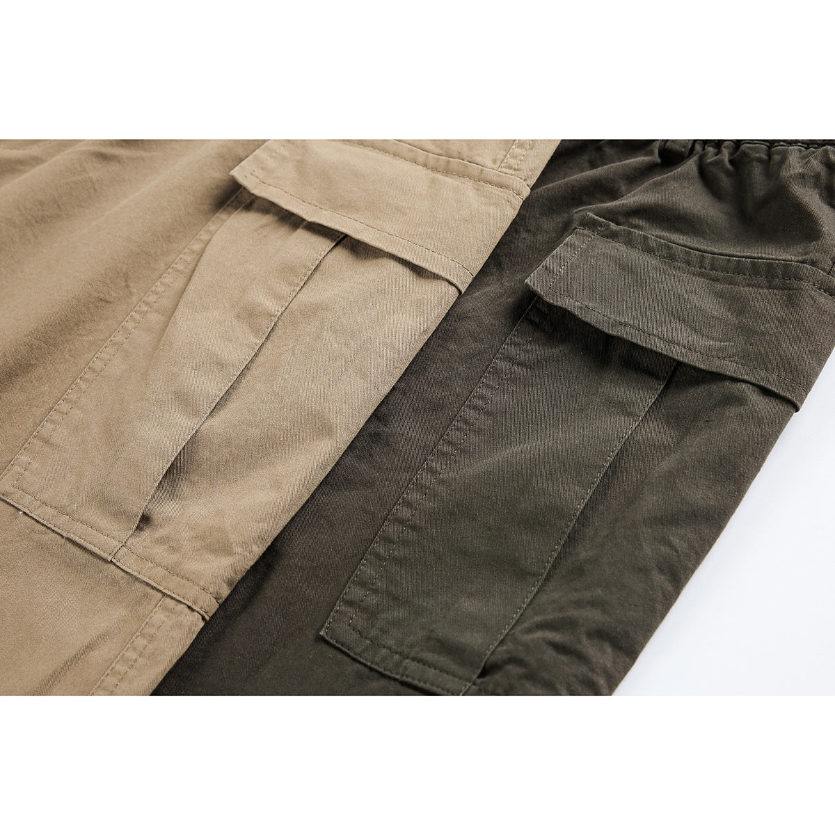 Close-up of tan and dark olive pants showing stitched cargo pockets and flap closures.