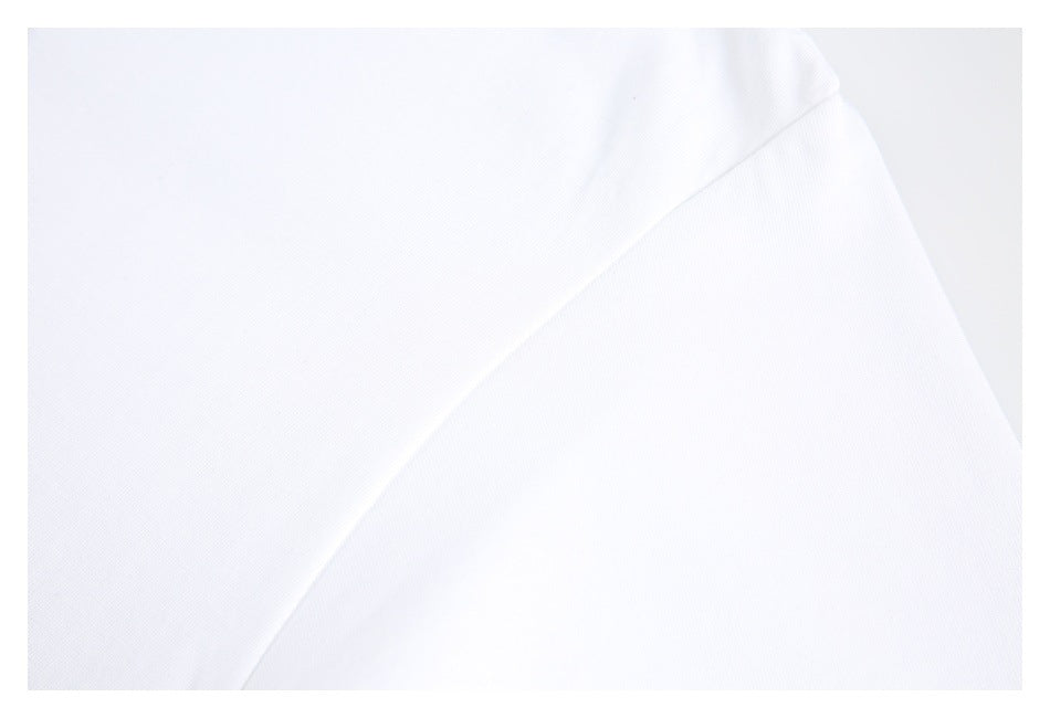 Close-up of a white shirt sleeve seam and fabric.