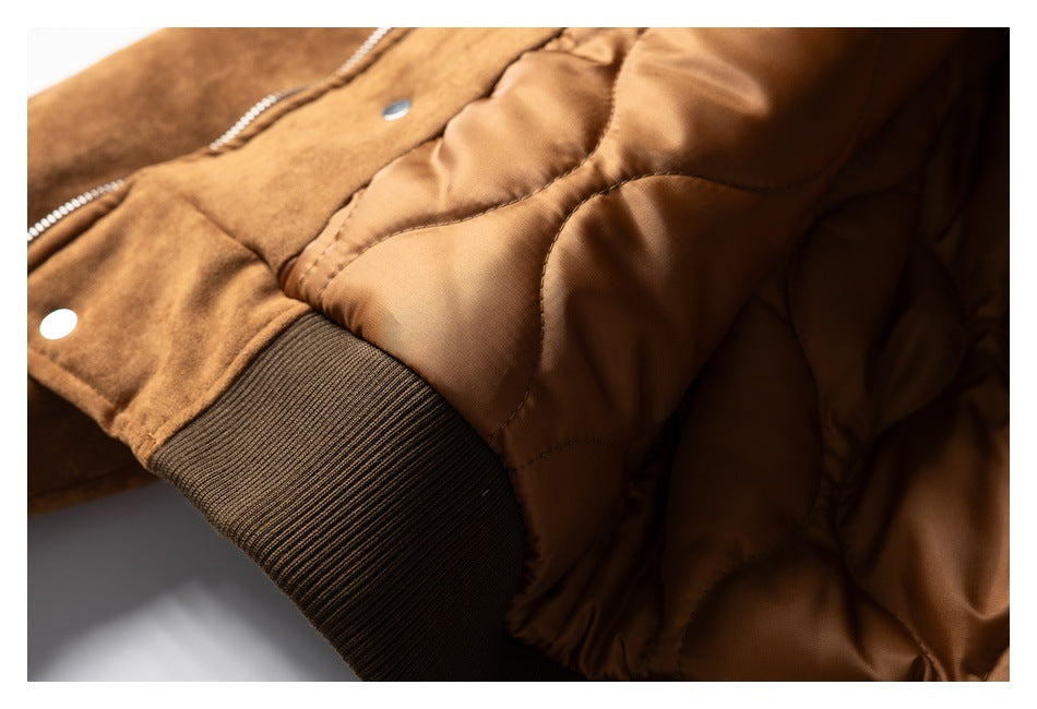 Close-up of the brown jacket's quilted lining, zipper edge, and dark ribbed cuff.