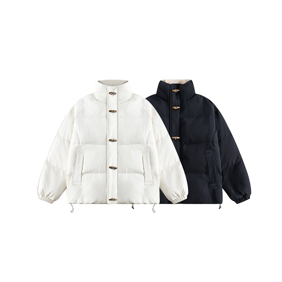 Ivory and dark padded jackets shown side by side, front view, with high collars and toggle closures.