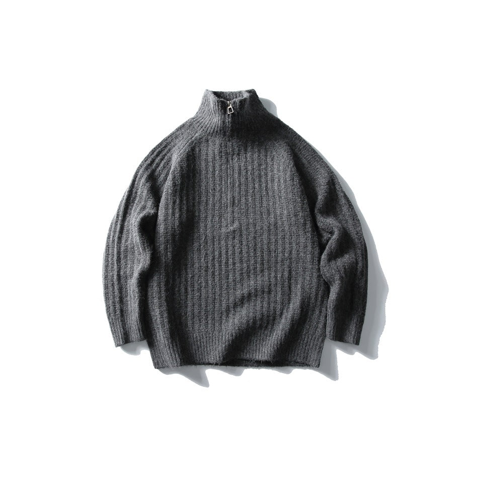 Dark gray ribbed half-zip high-collar sweater laid flat, front view