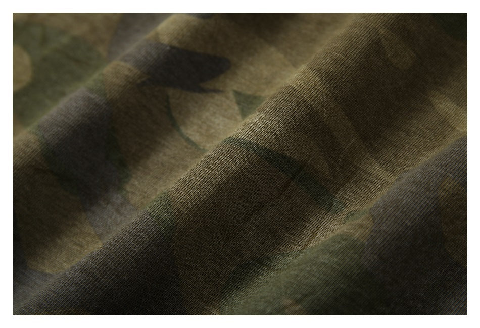 Macro view of the knit texture and folds in camouflage fabric.