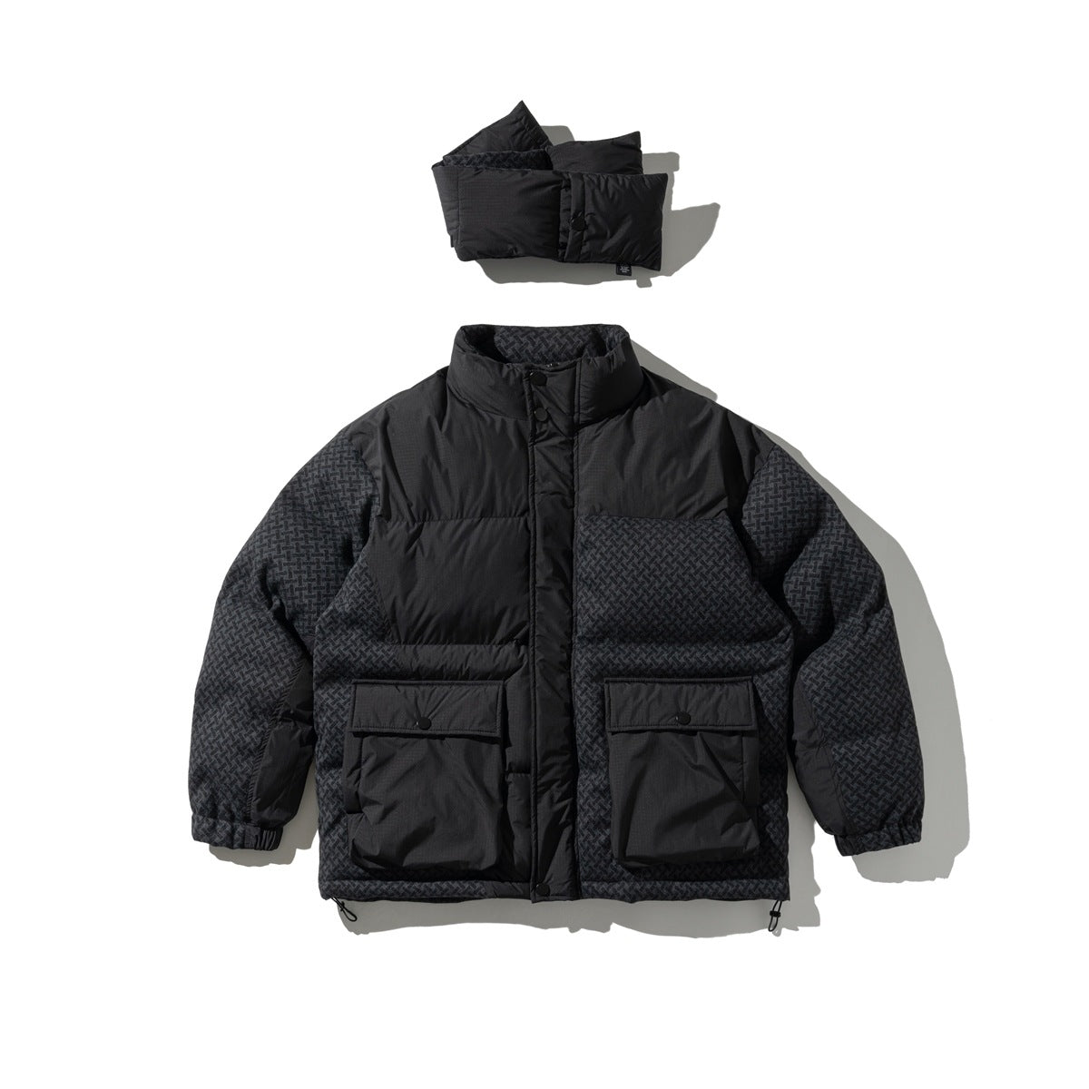 Black quilted jacket with stand collar and flap pockets laid flat with detached padded scarf above