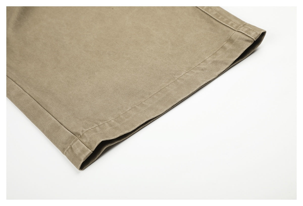 Close-up of the wide-leg beige pant hem and finished stitching.