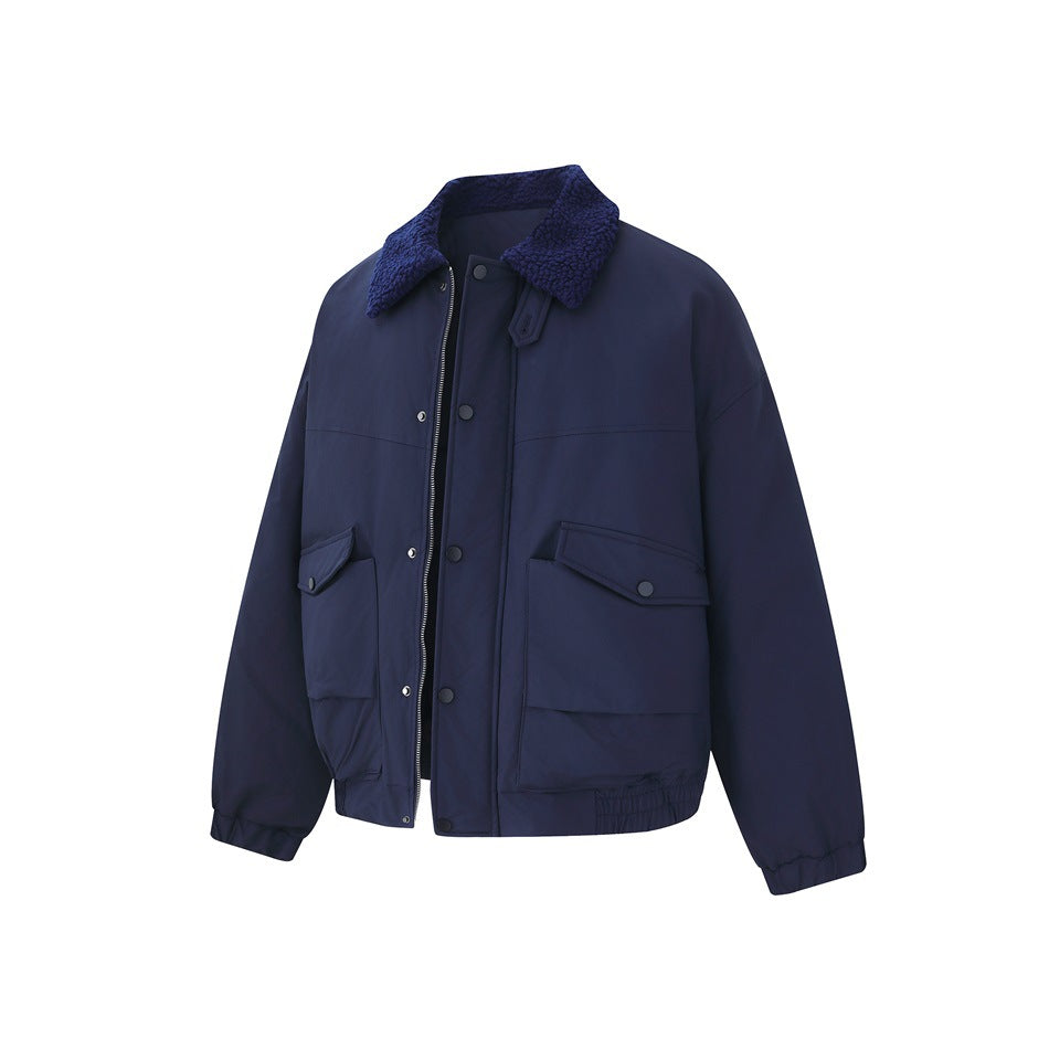 Front view of a navy jacket with a textured collar, zip and snap closures, flap pockets, and gathered cuffs and hem.