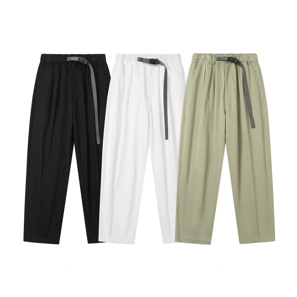 Three pairs of front-facing trousers in black, white, and light olive, each with a gray webbing belt.