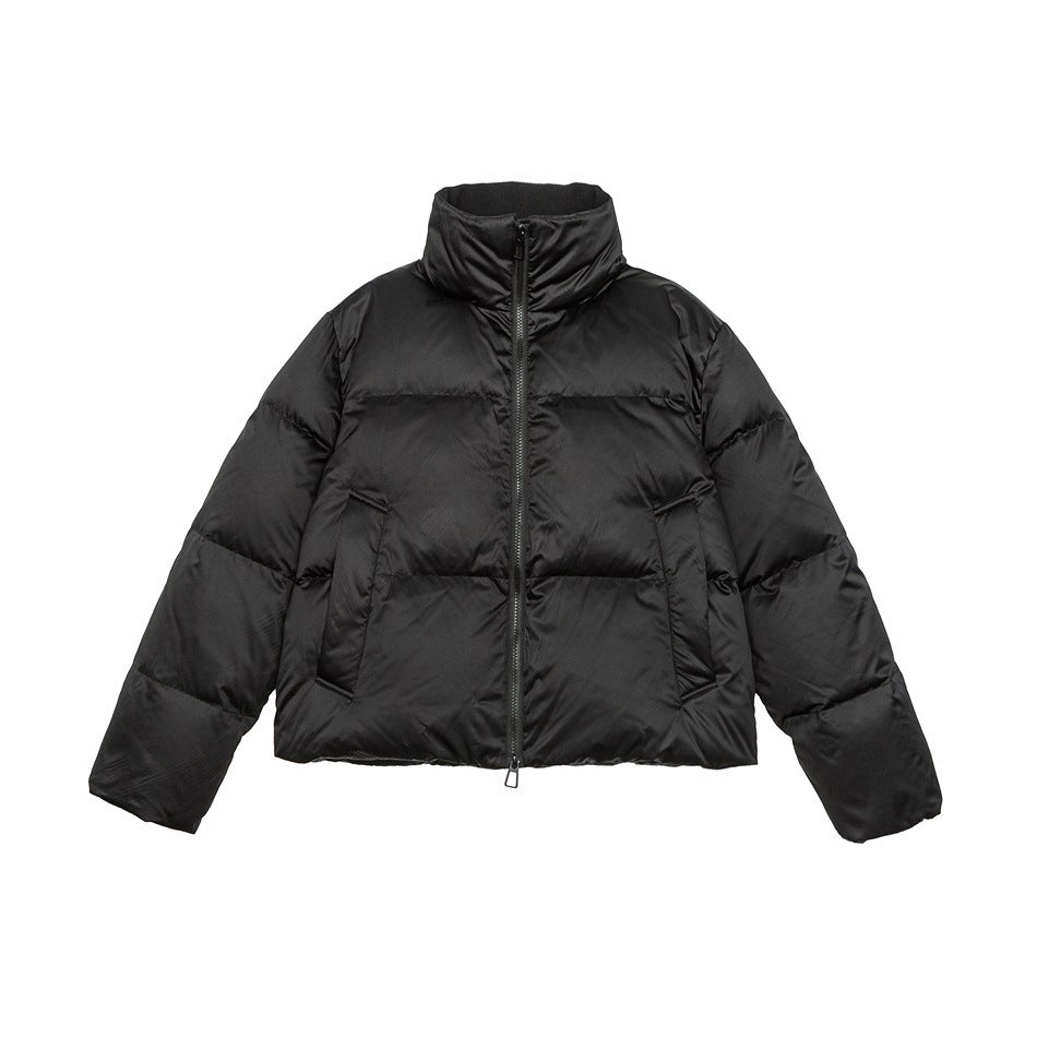 Black stand-collar puffer jacket with front zipper, quilted channels and two front pockets, flat lay front view