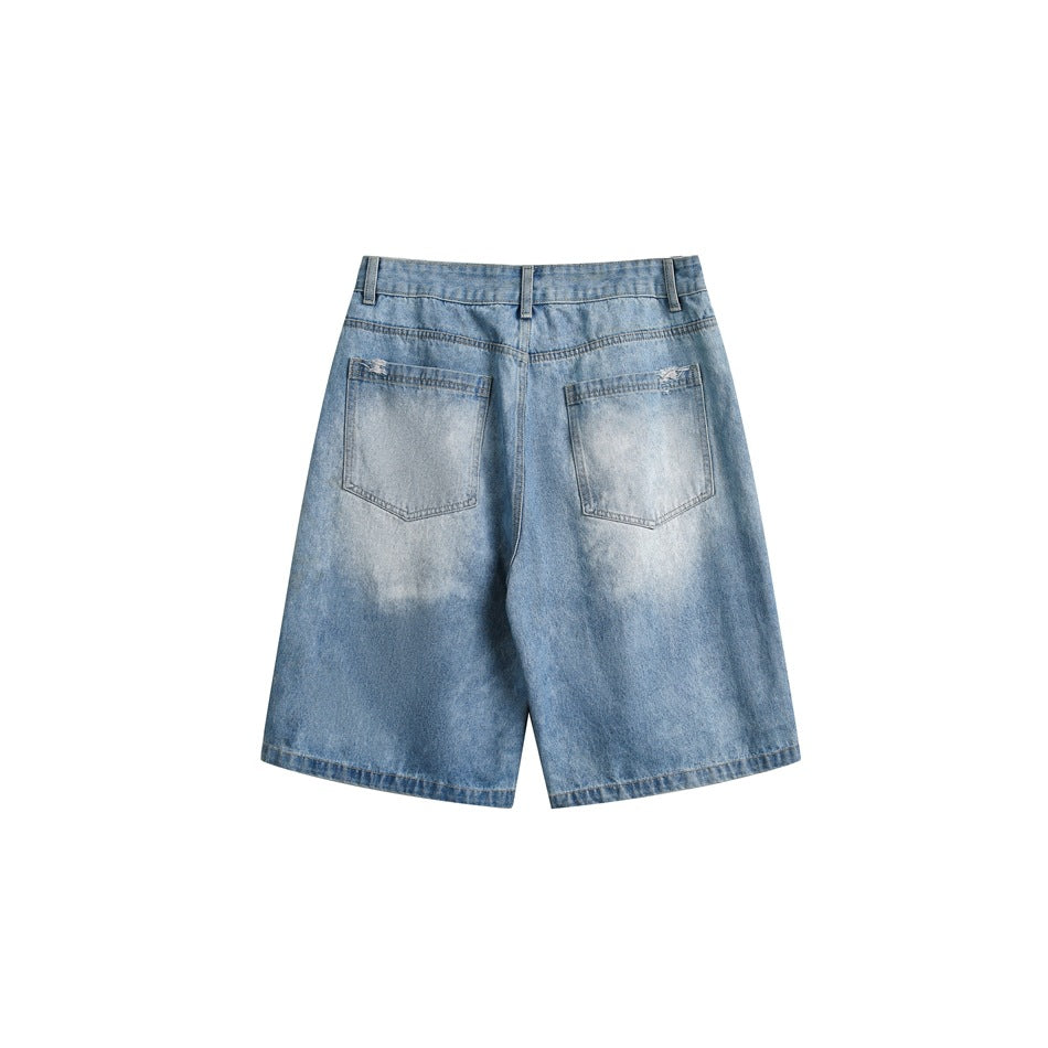 Back view of light blue denim shorts with two patch pockets and a faded wash.
