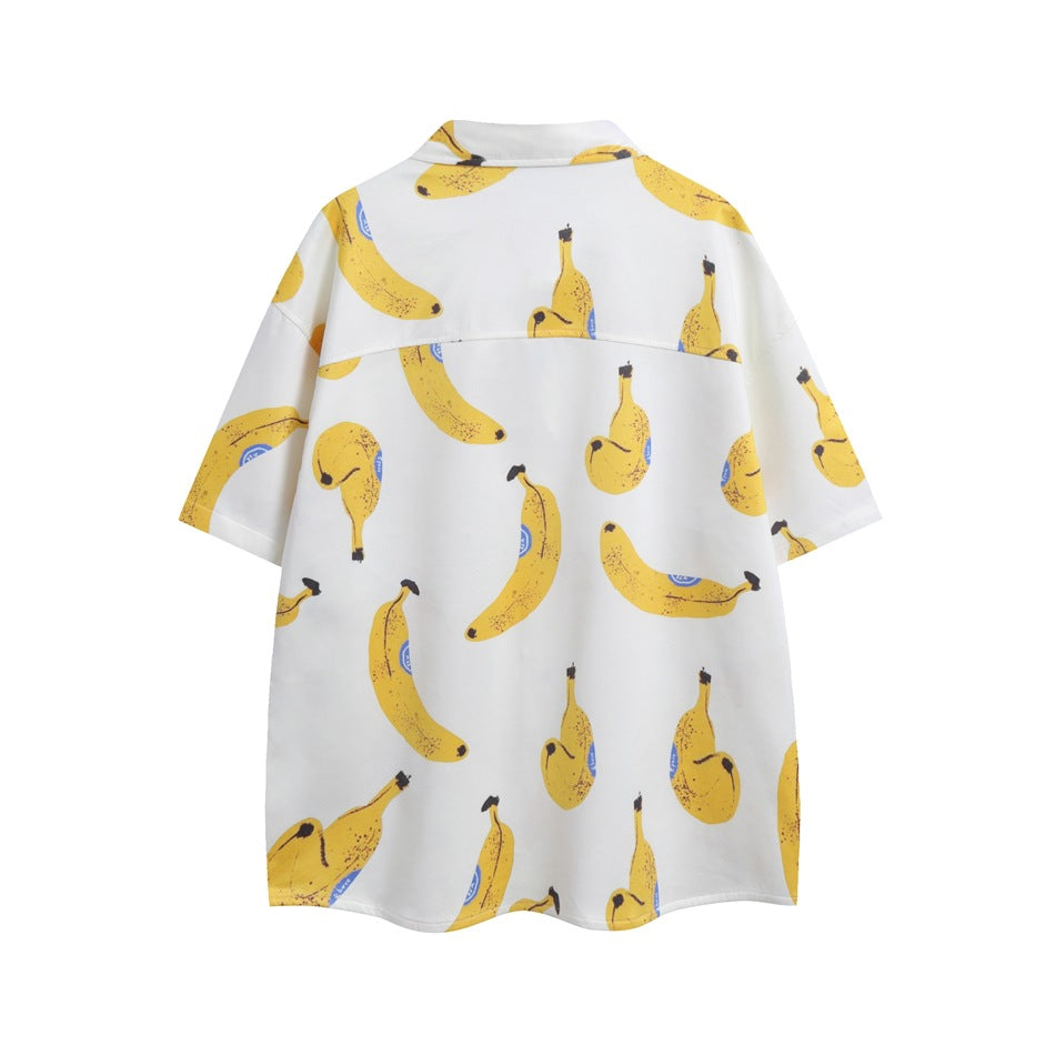 Back view of a white short-sleeve button-up shirt covered in yellow banana prints.