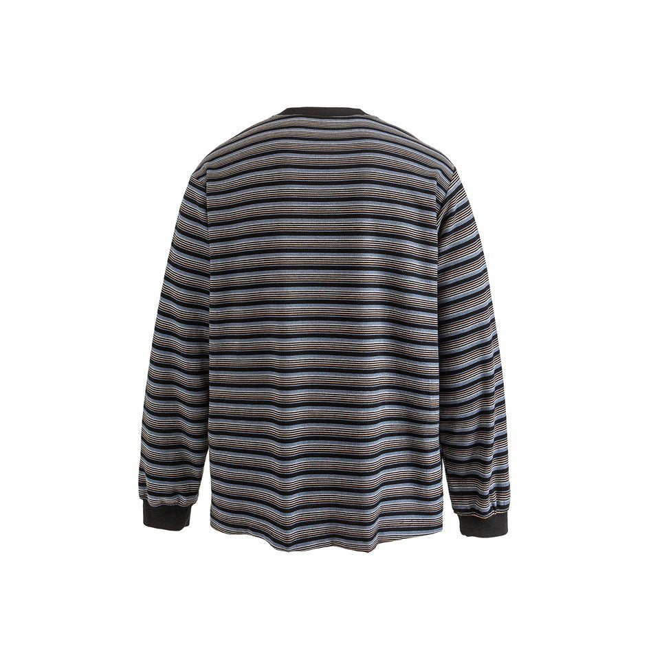 Back view of a black long-sleeve crewneck top with fine blue, cream, and tan horizontal stripes.