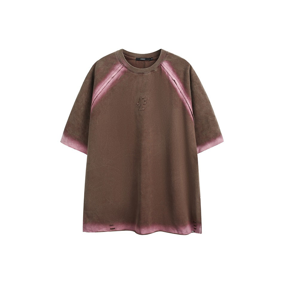 Brown short-sleeve raglan T-shirt with pink gradient edges, embossed chest graphic and small slits at the hem, flat front