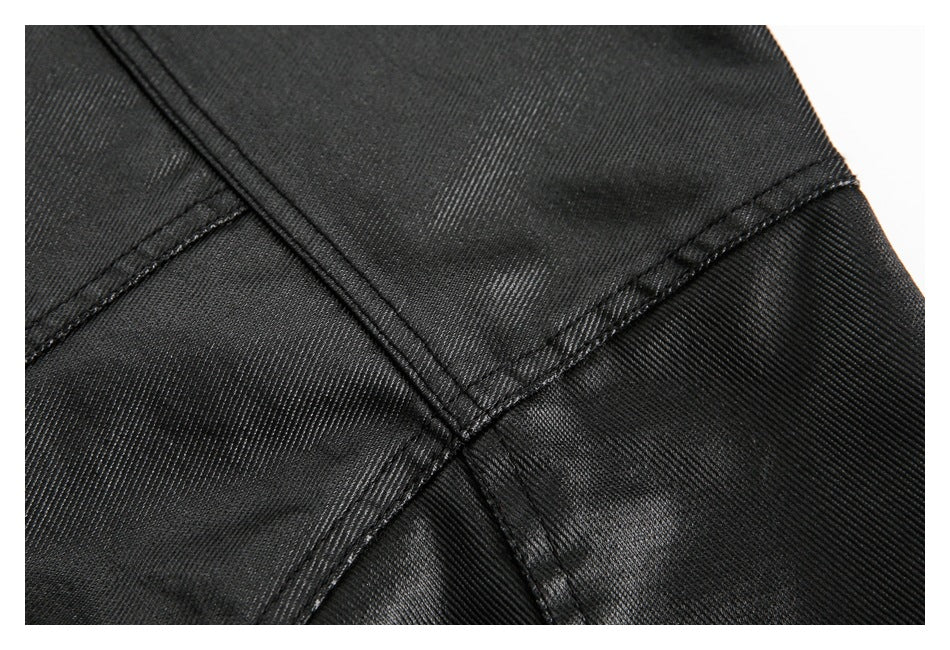 Close-up of black garment panels joined by intersecting stitched seams.