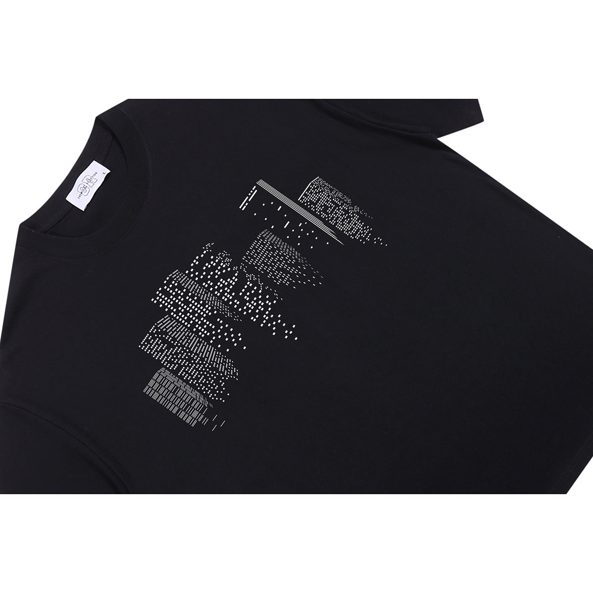 Angled flat lay of a black crew-neck T-shirt with a white abstract geometric chest print.