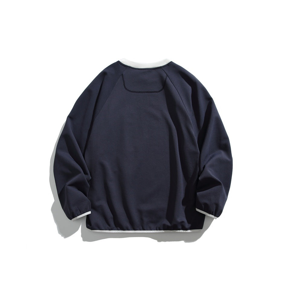 Back view of navy blue raglan sweatshirt with white neck, cuff and hem trim