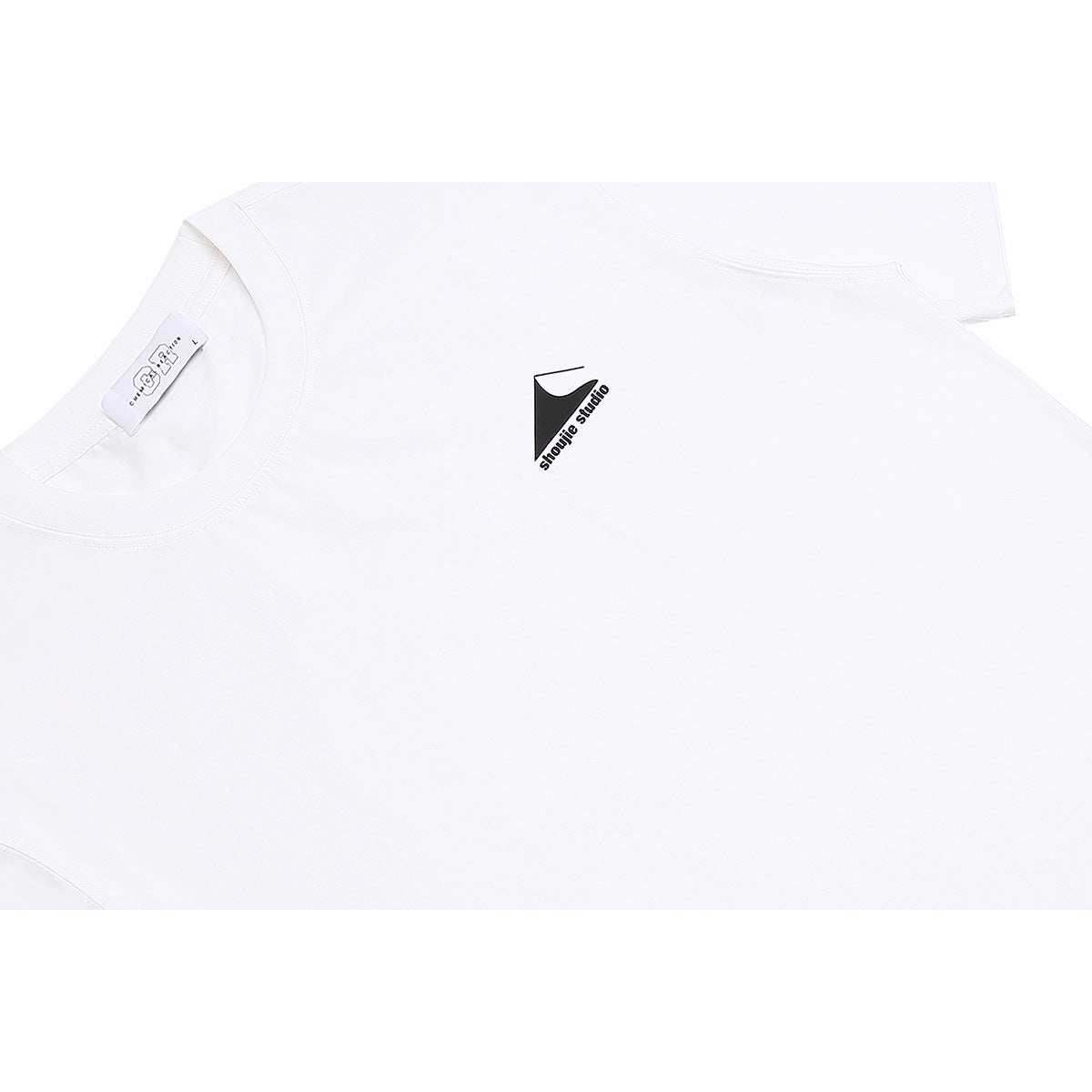 Close-up of a white crew-neck T-shirt with a small black chest logo and the inside neck label visible.