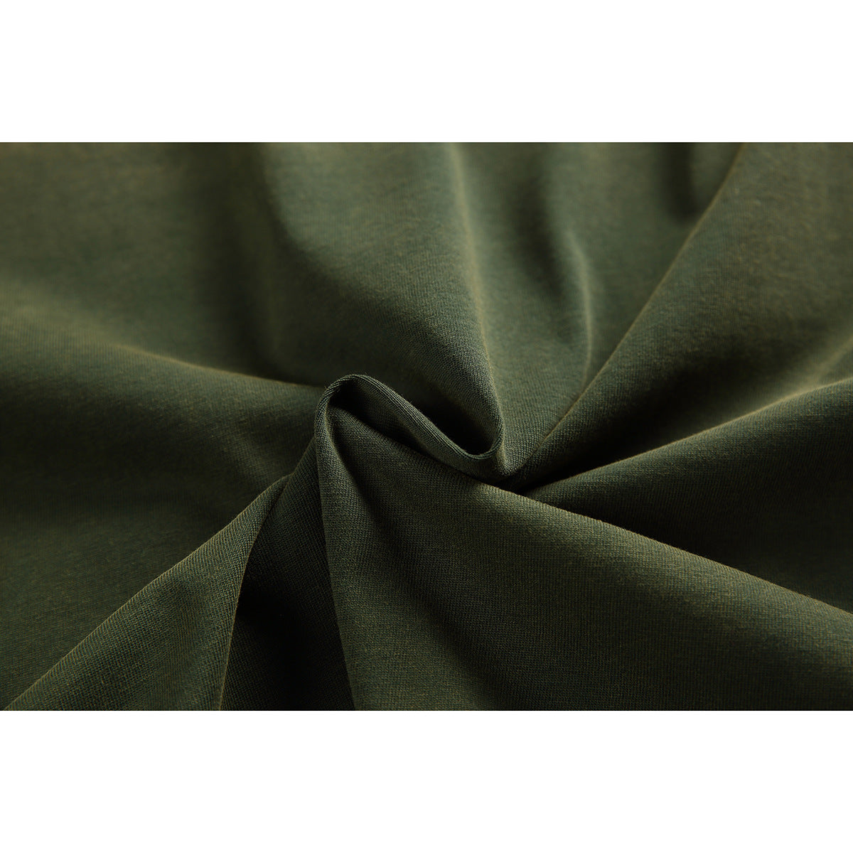 Macro view of dark olive fabric gathered into folds, showing its surface texture.