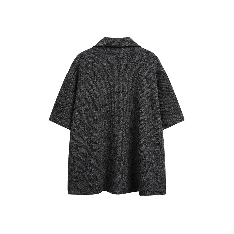 Back view of a charcoal gray textured, short-sleeved collared garment on a white background.