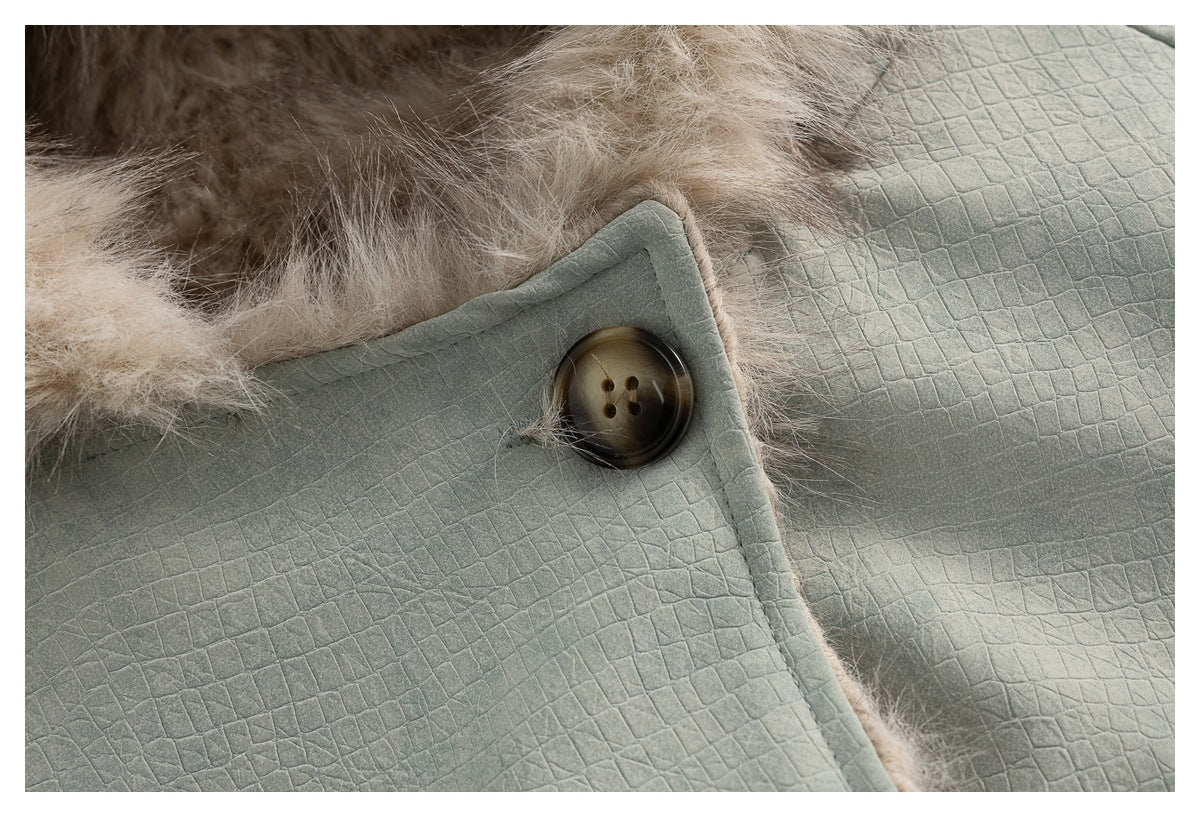 Close-up of a large brown button, beige hood fur and the jacket's embossed grid-textured fabric.