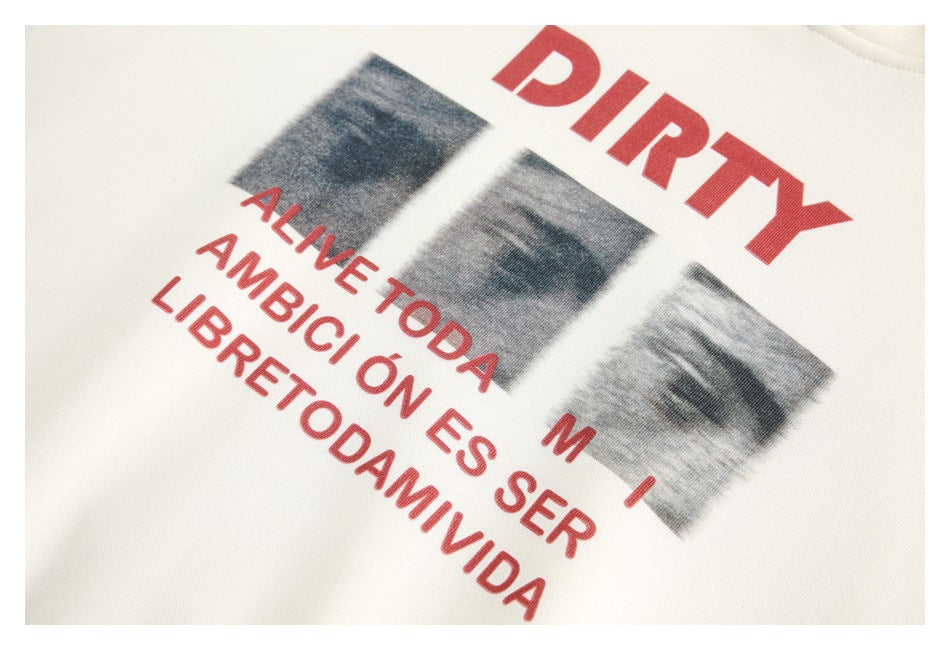 Close-up of red English lettering and grayscale imagery printed on ivory fabric.