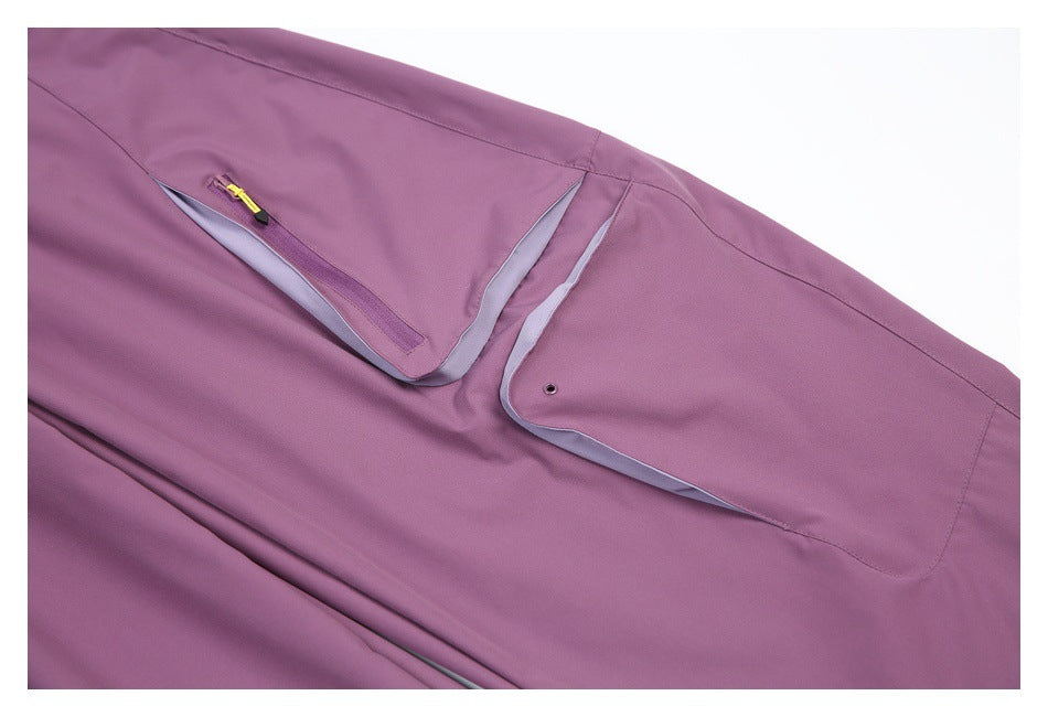 Close-up of a mauve pant leg with a zip pocket, yellow zipper pull, and a flap pocket with gray lining.