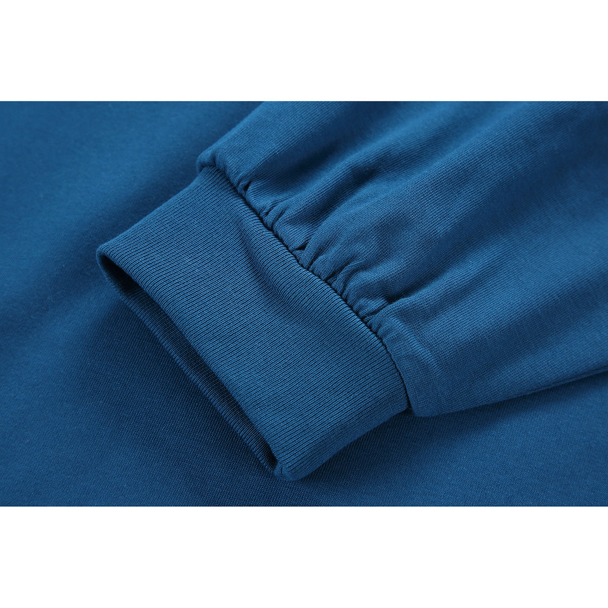 Close-up of the blue shirt’s gathered sleeve and wide ribbed cuff.