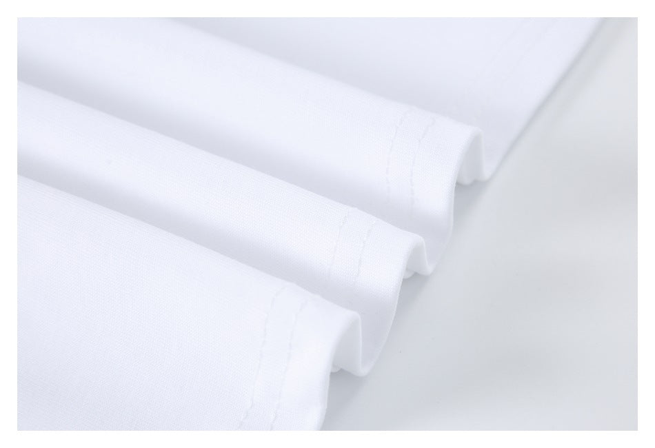 Close-up of folded white fabric showing a stitched edge and hem.