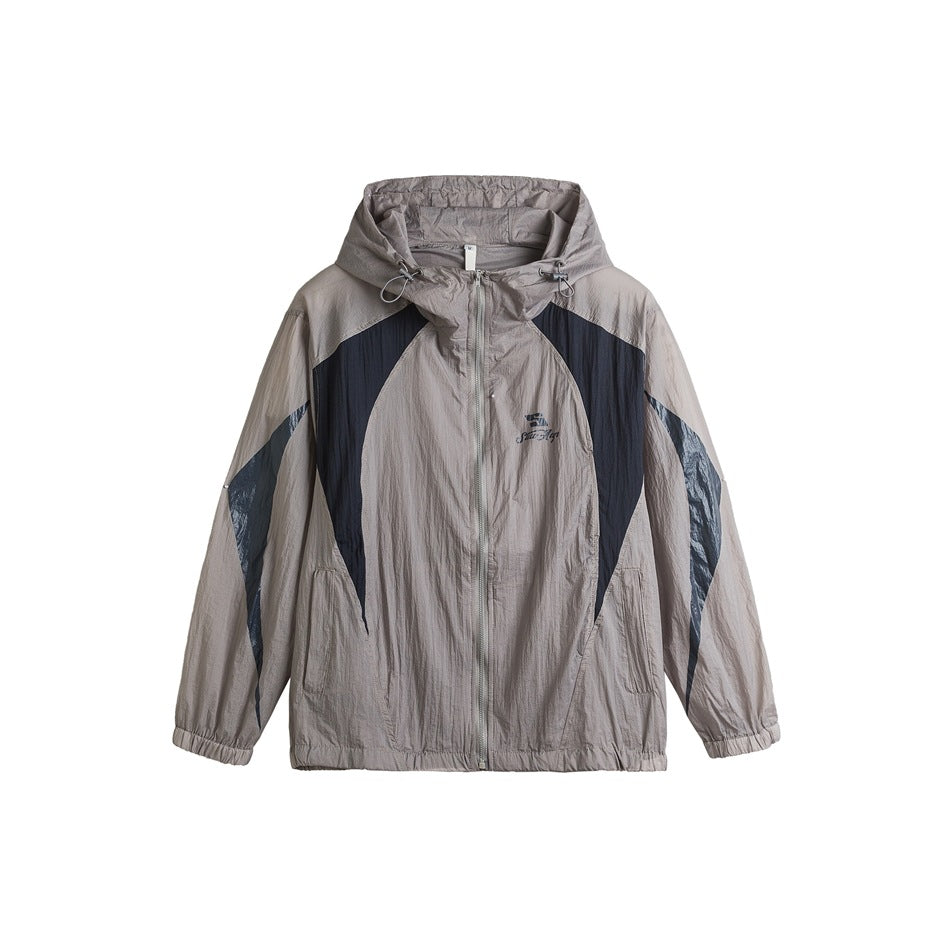 Gray hooded zip jacket with navy color-block panels, flat front view on white background