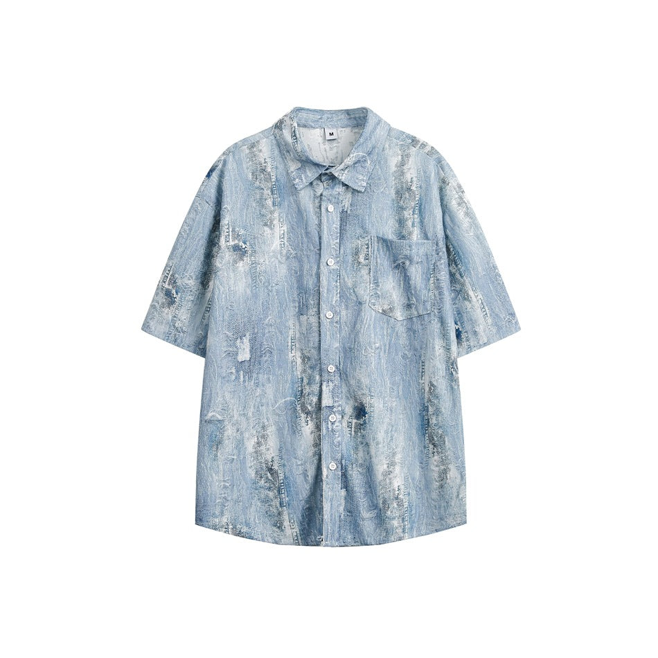 Light blue distressed denim-look short-sleeve button-up shirt with chest pocket, flat lay front view
