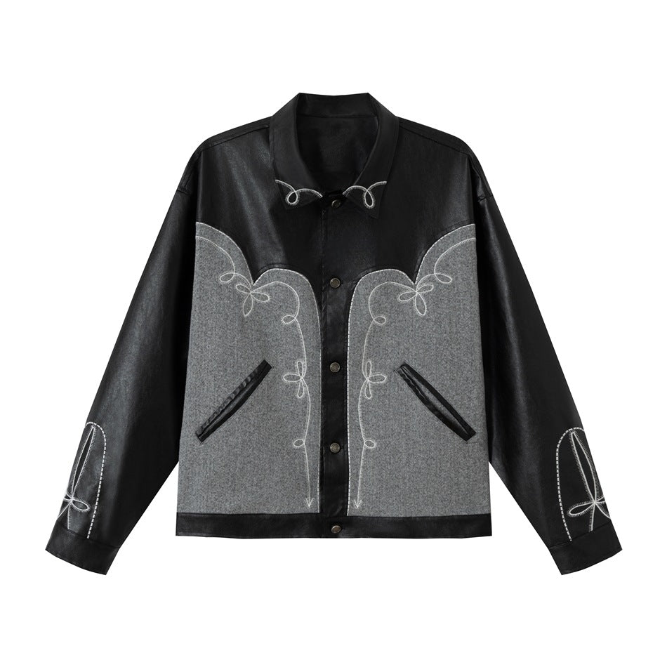 Black faux leather-look jacket with gray textured panels and white embroidered scroll details, flat front view