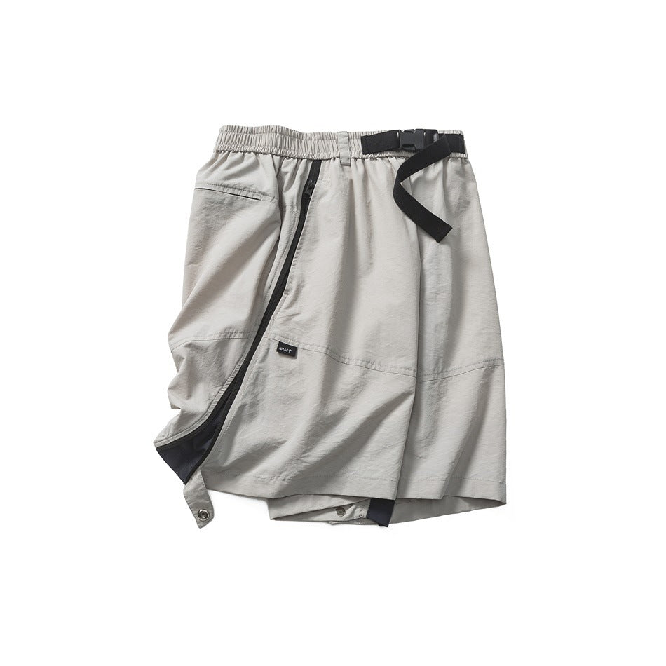 Light gray utility shorts with a gathered waist, black buckle belt, and angled black-zip pocket detail.