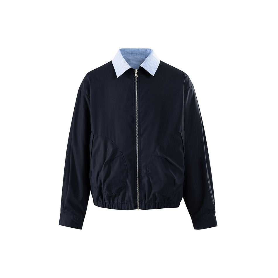 Navy zip-front jacket with light blue check collar, curved front pockets and elastic hem, front view