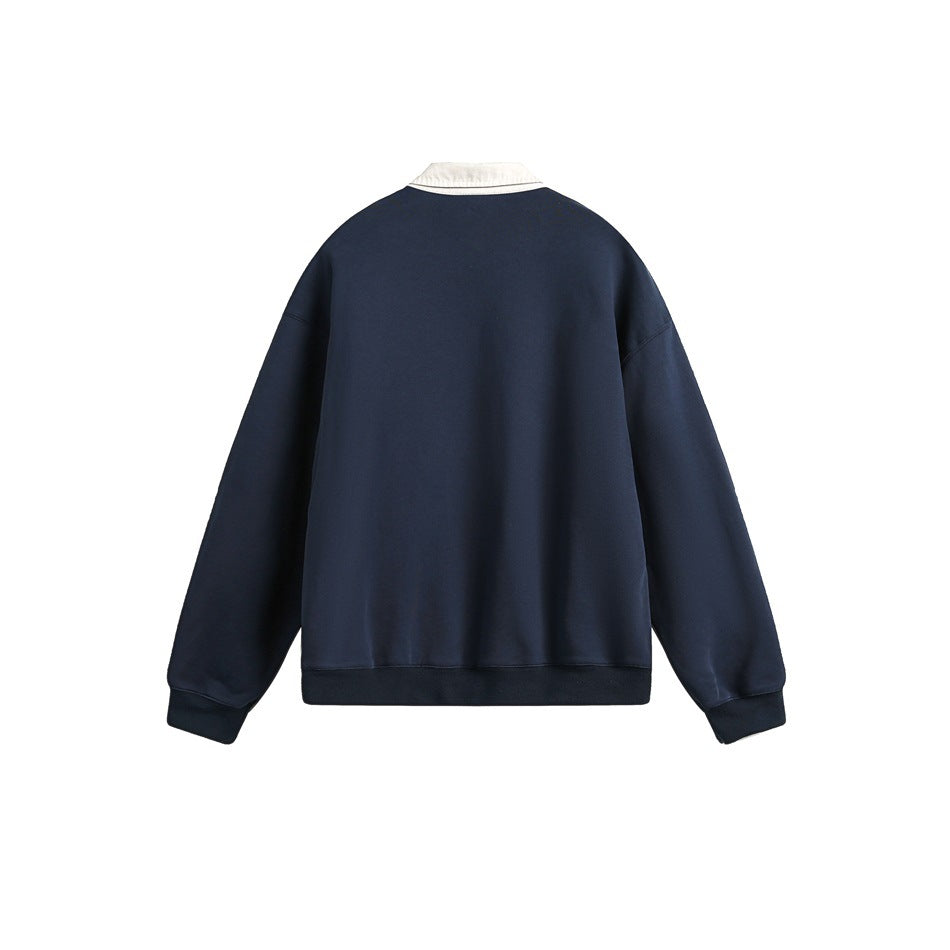 Back view of a navy sweatshirt with a contrasting cream pointed collar, ribbed cuffs, and ribbed hem.
