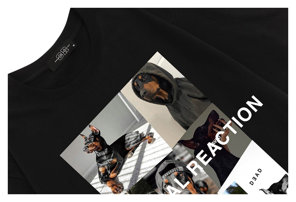 Close-up of a black T-shirt with a collage of dog photos and large white lettering across the chest.