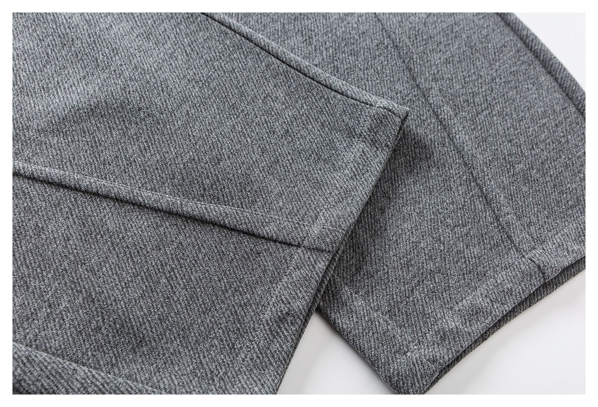 Close-up of heather gray jogger leg fabric, seams, and folded hem.