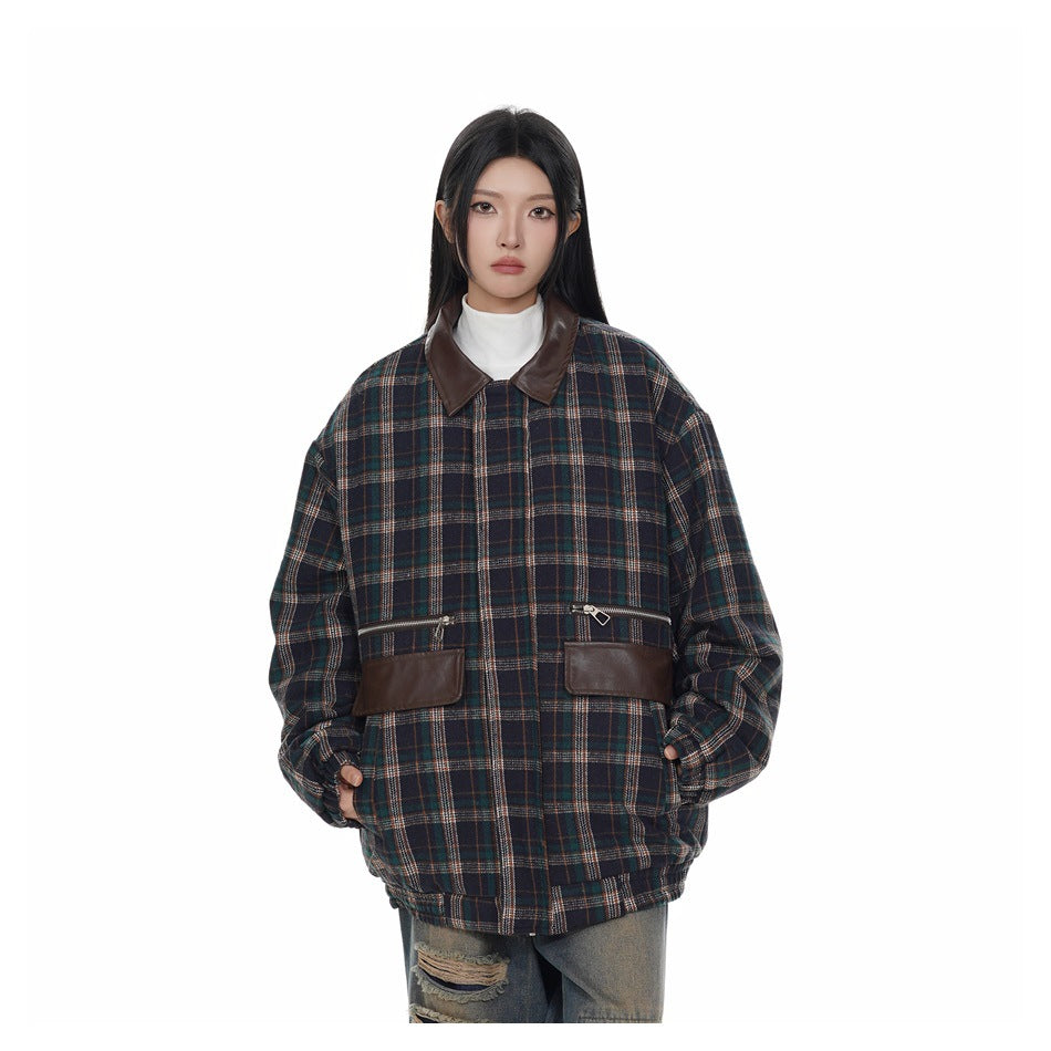 Model wearing the navy plaid jacket with brown collar and flap pockets over a white high-neck top and distressed jeans