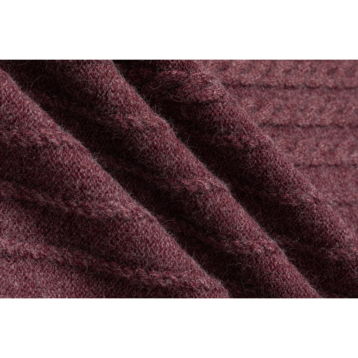 Macro view of the burgundy marled sweater's fuzzy knit texture and raised pattern.