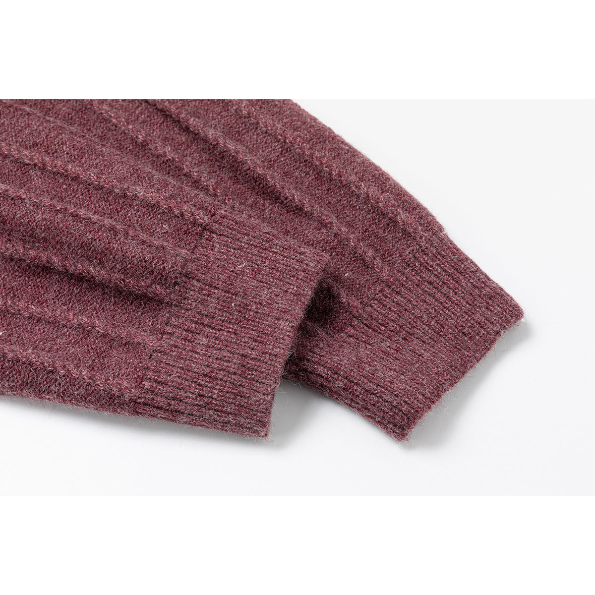 Close-up of burgundy marled knit sweater sleeves showing ribbed cuffs.