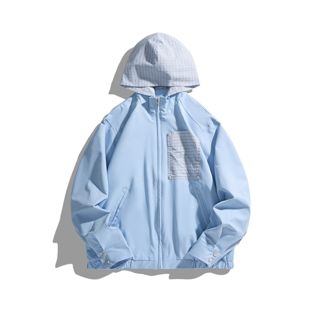 Sky blue zip jacket with plaid hood, plaid chest pocket with snaps, front slash pockets and snap cuffs, flat front view