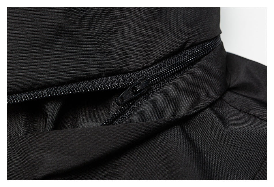 Close-up of a black jacket seam with a black zipper.