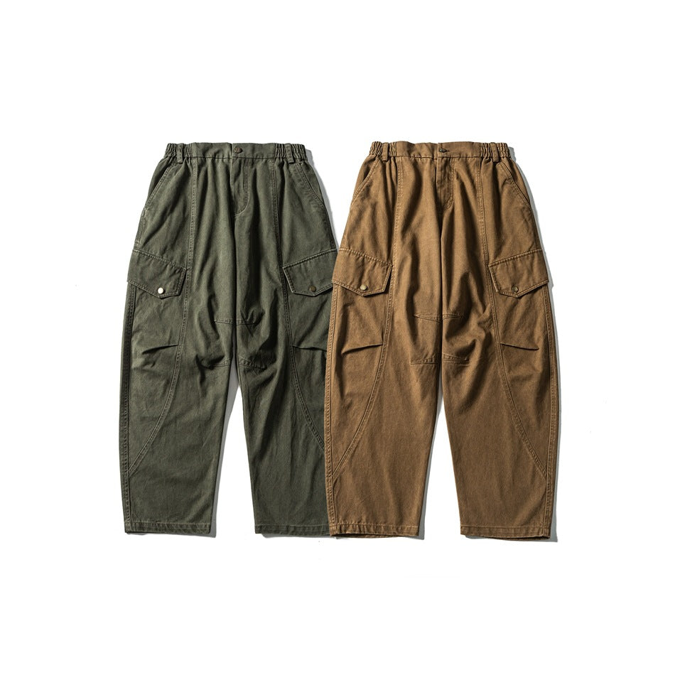 Front view of relaxed cargo pants in olive green and tan, with elastic waists and flap pockets.