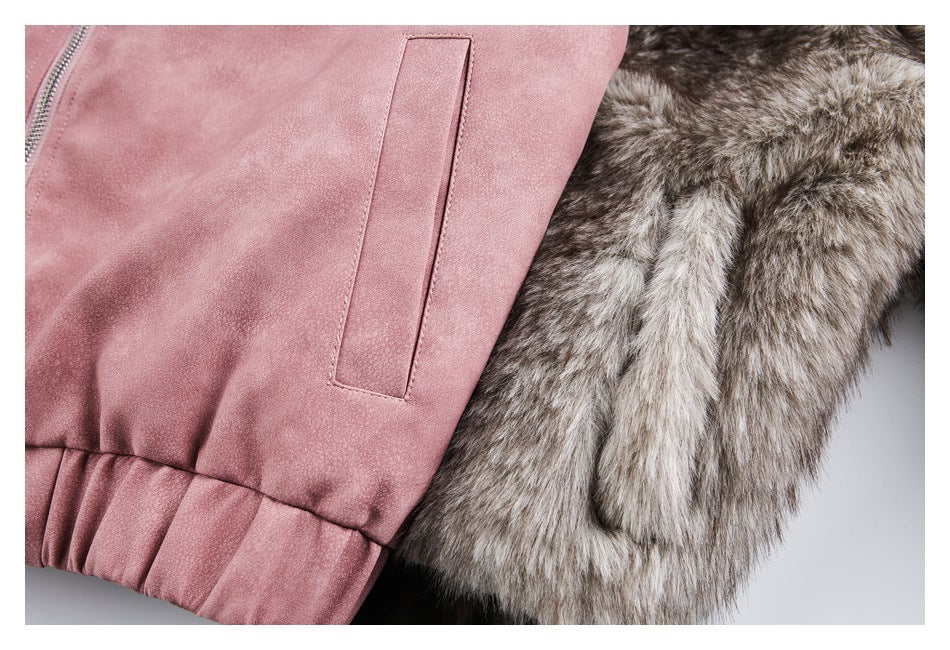 Close-up of the jacket's dusty-rose welt pocket, gathered hem, and gray-brown fur trim.