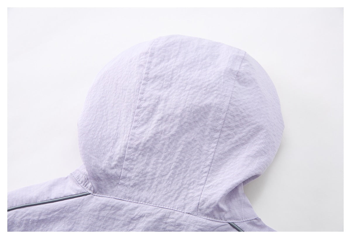 Close-up of the pale lilac top's hood and rear neckline seam.