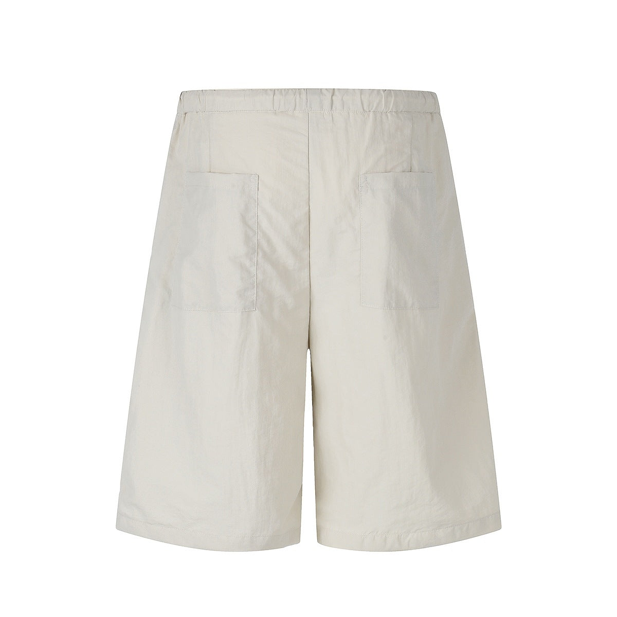 Back view of off-white, wide-leg shorts with an elastic waistband and two patch pockets.