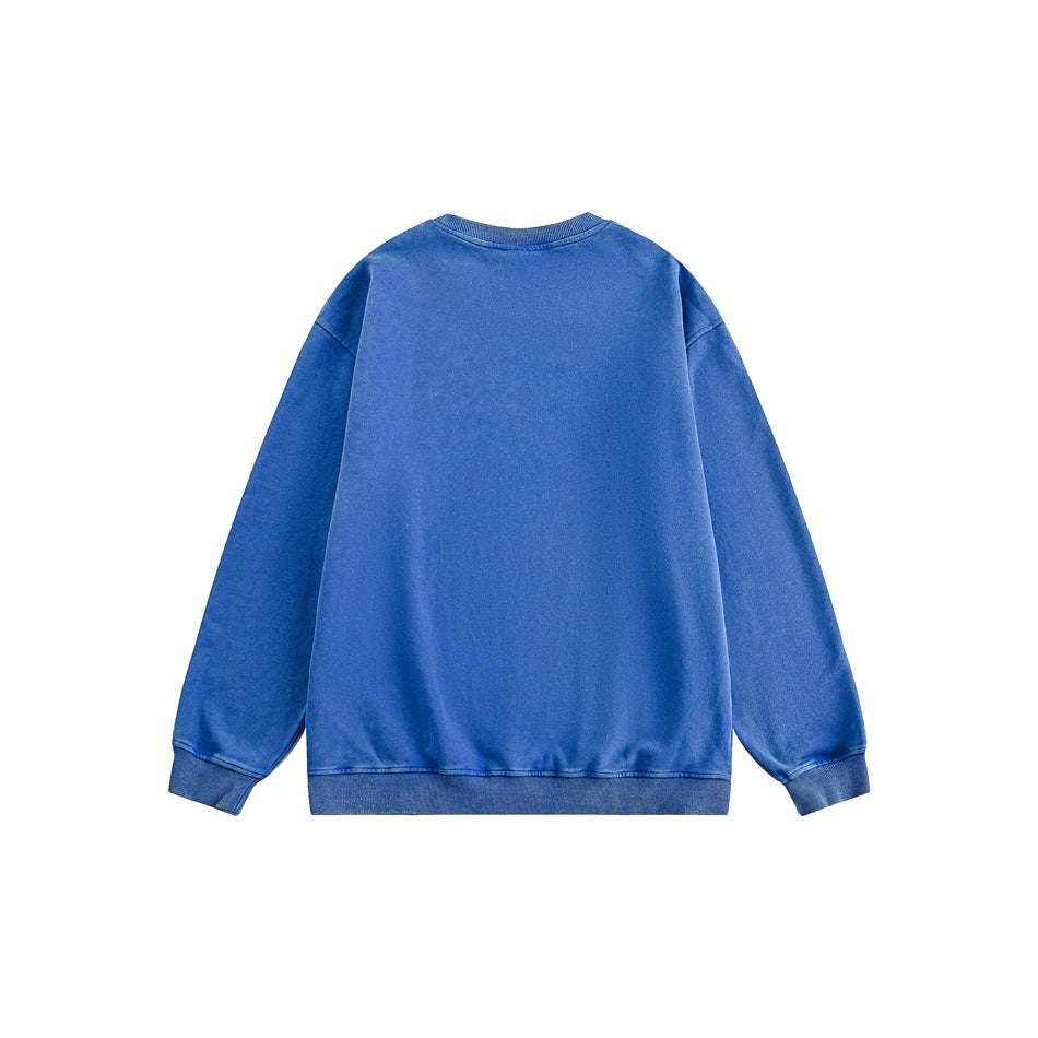 Back view of a plain blue long-sleeve crewneck sweatshirt with ribbed cuffs and hem.
